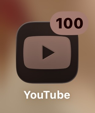 Screenshot of the YouTube app on an iPhone with 100 unread notifications